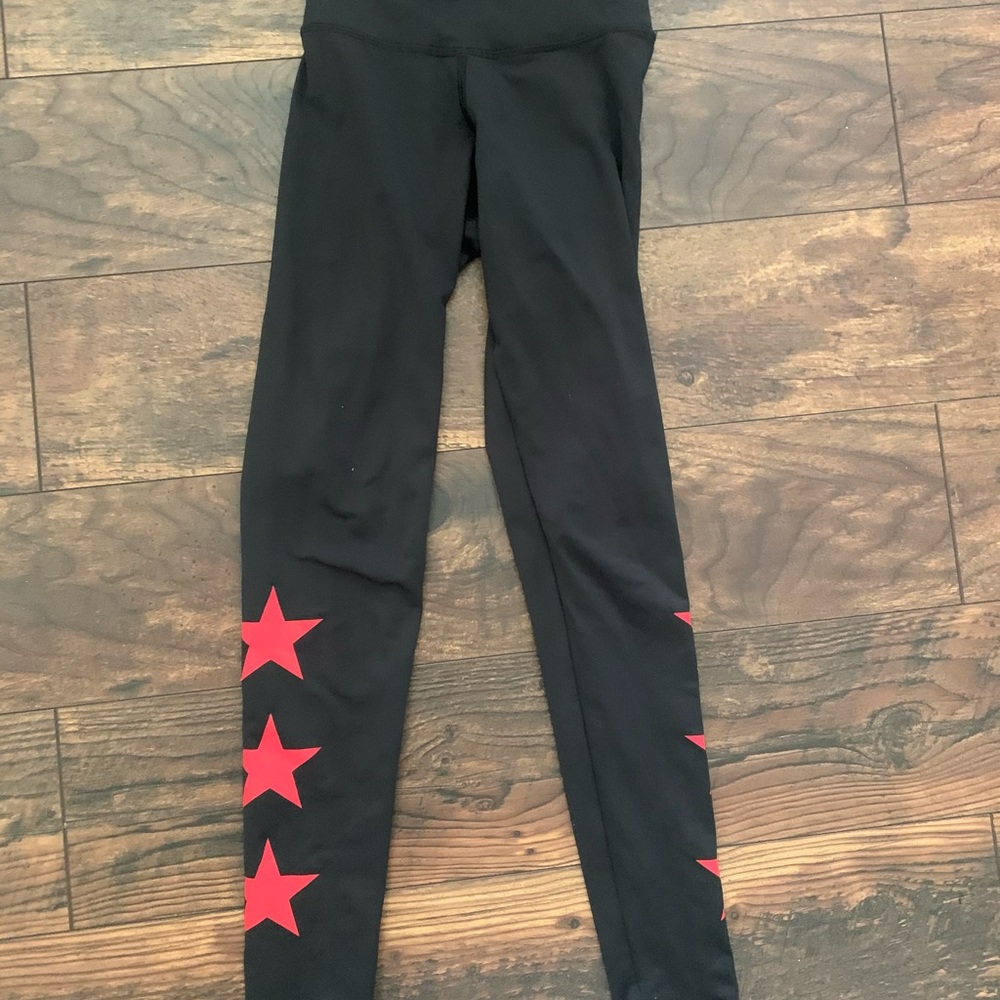Black leggings with red stars down the sides